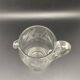 Glass jug with chiseled pattern