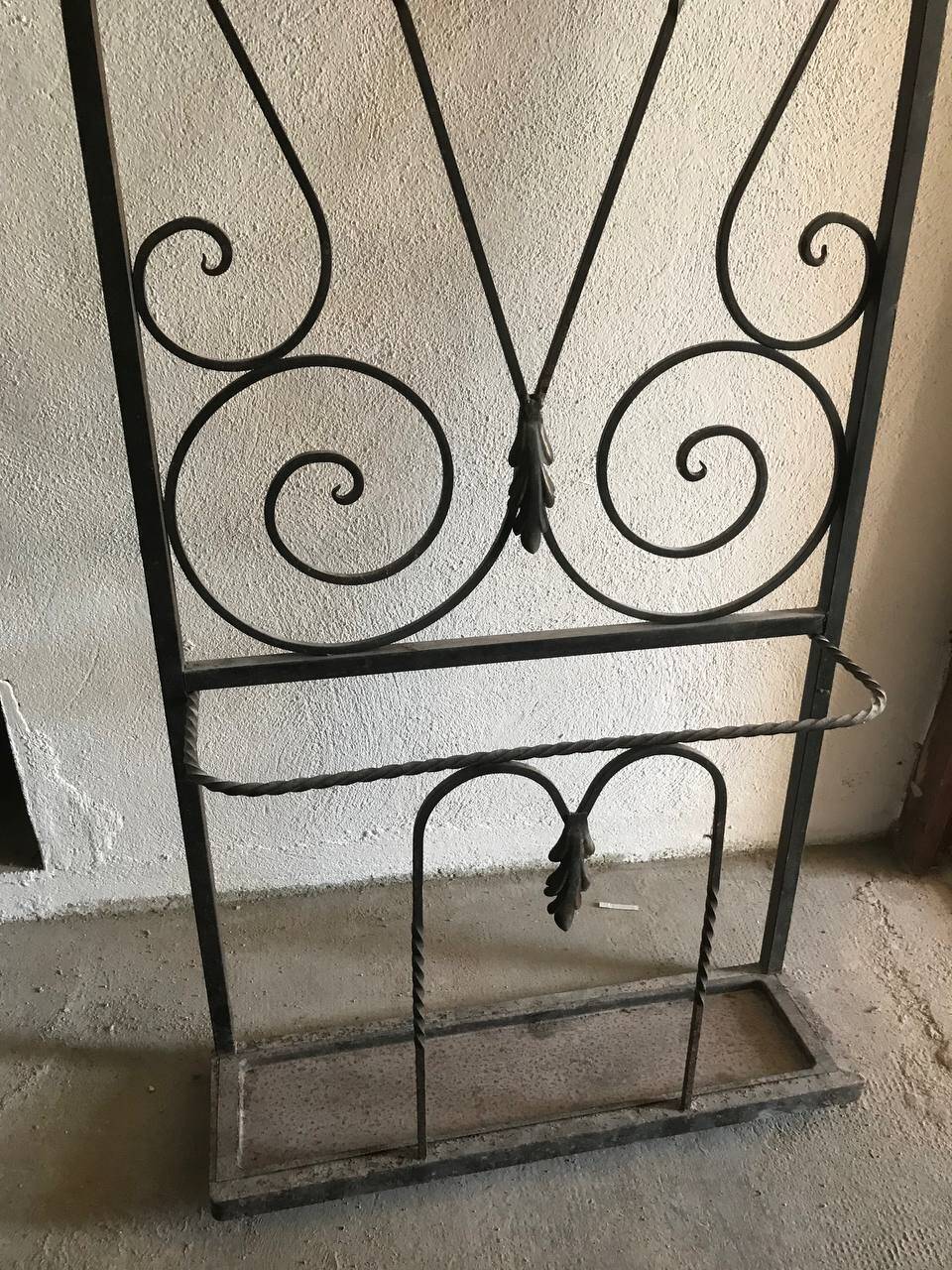 Wrought iron coat rack and shelf