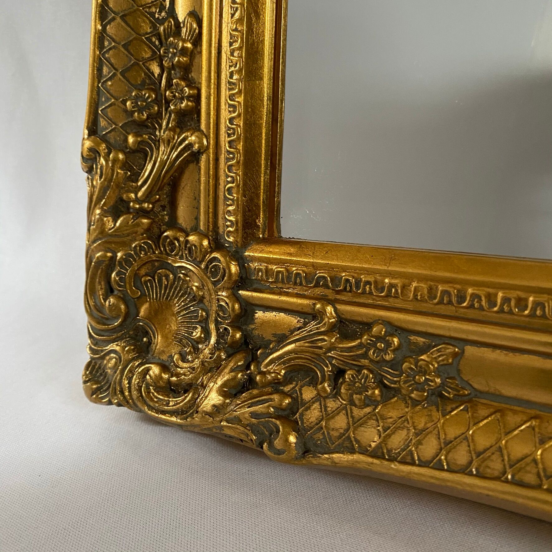 Bevelled mirror, golden empire style 74x64cm
