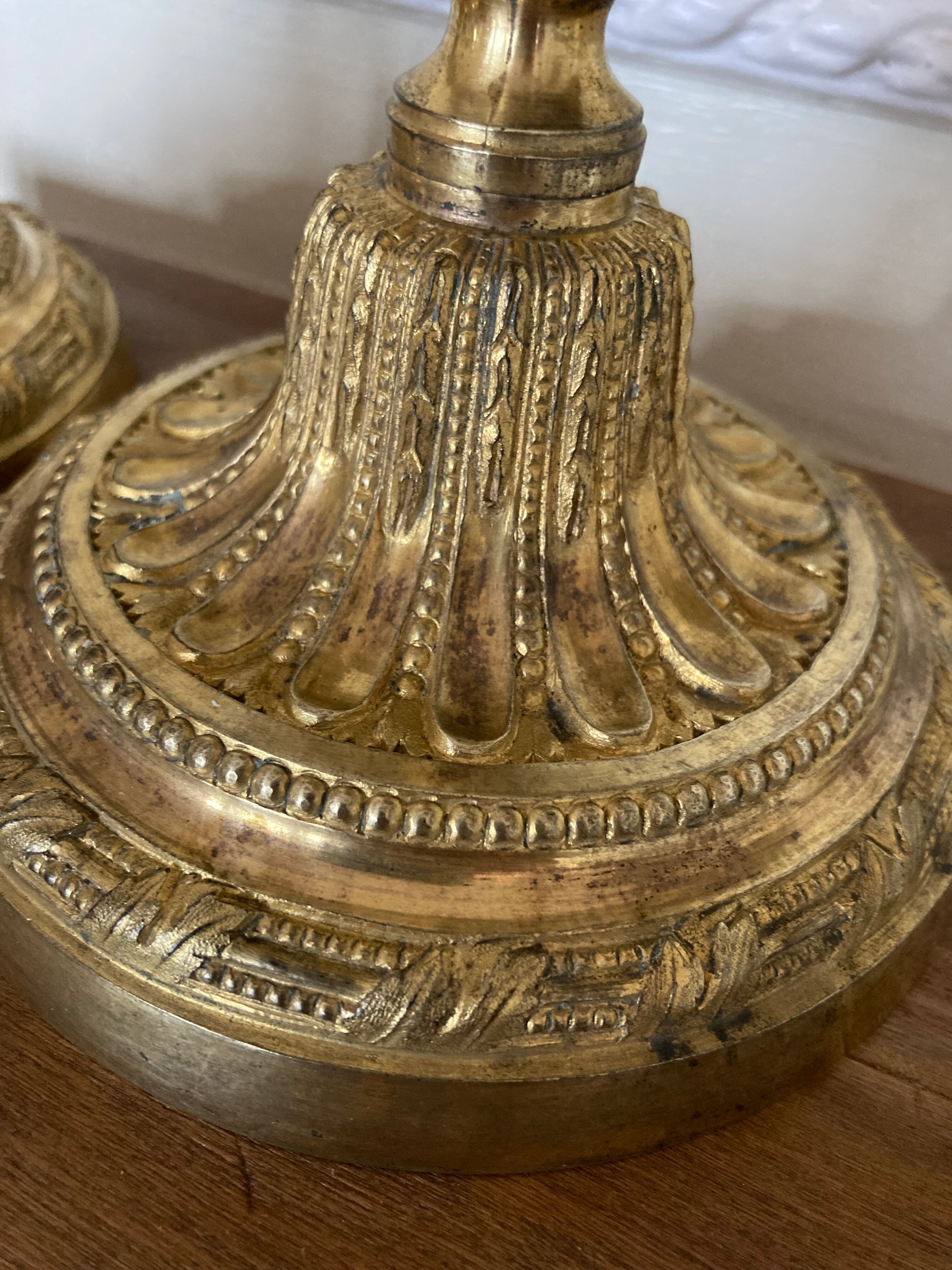 Pair of Louis XVI torch candlesticks in gilded bronze