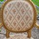 Paire de fauteuils médaillon en bois doré style Louis XVI