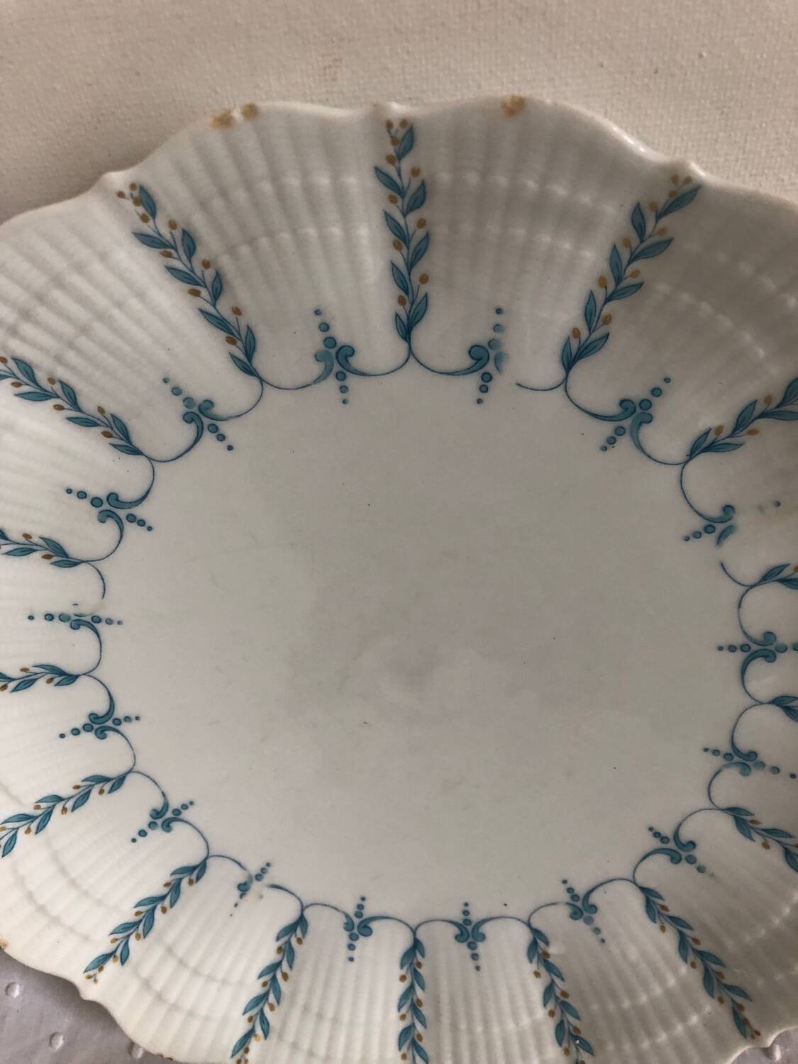 Set of 4 antique Giraud Sauviat porcelain plates.