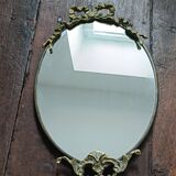 Antique mirror, oval with brass crest