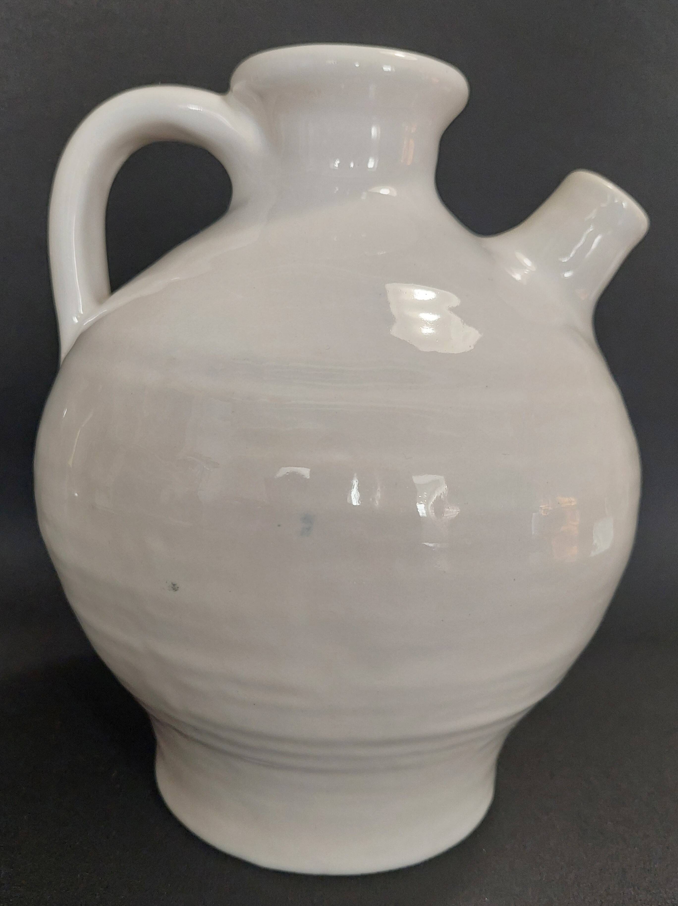 White ceramic goat-shaped creamer, first half of the 20th century.