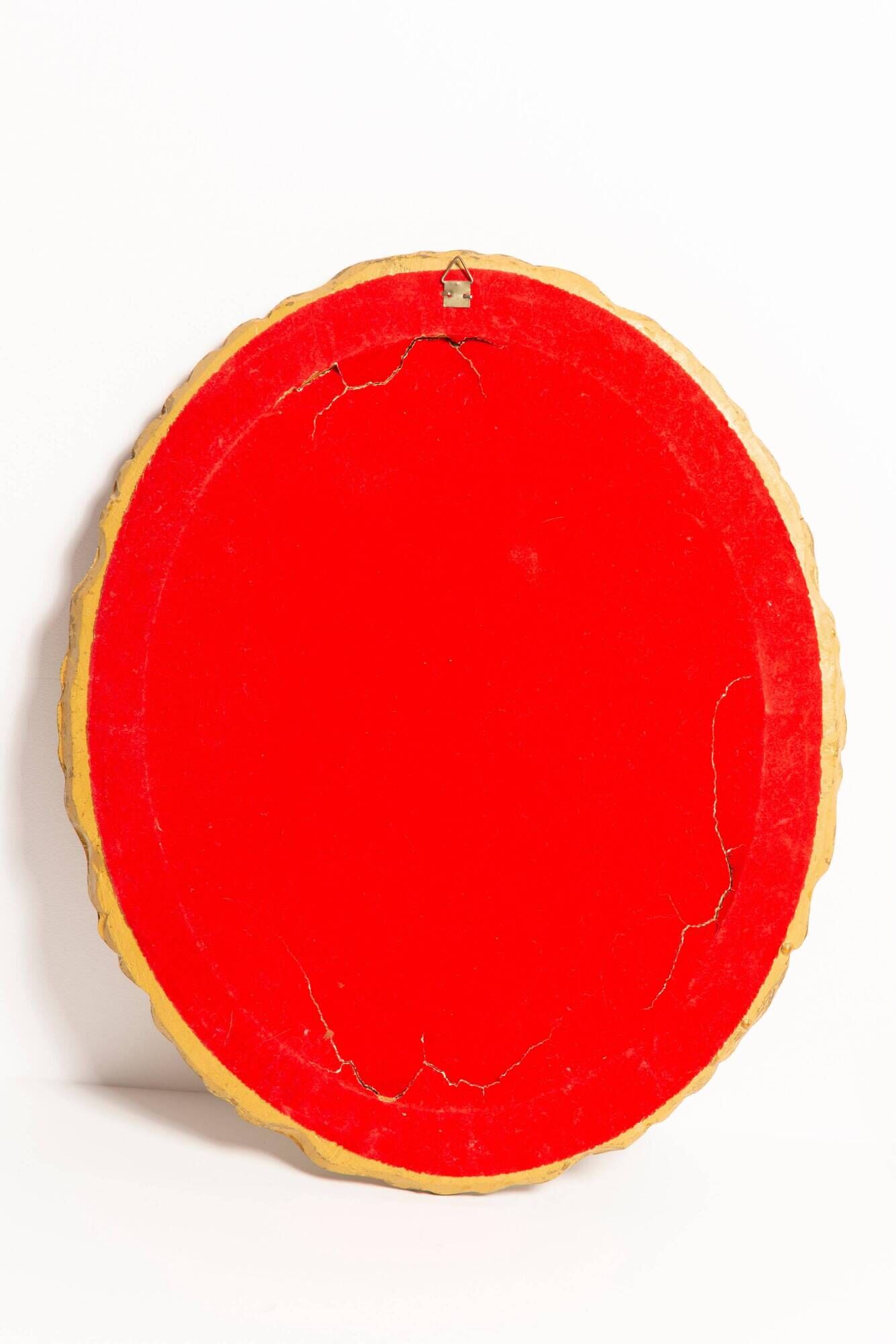 Vintage oval decorative mirror in gilded wood with floral frame, Italy, 1960s.