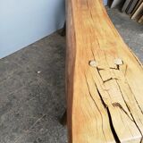 Big bench in solid rough wood very thick Brutalism