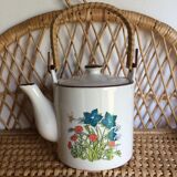 Vintage teapot with wicker handle