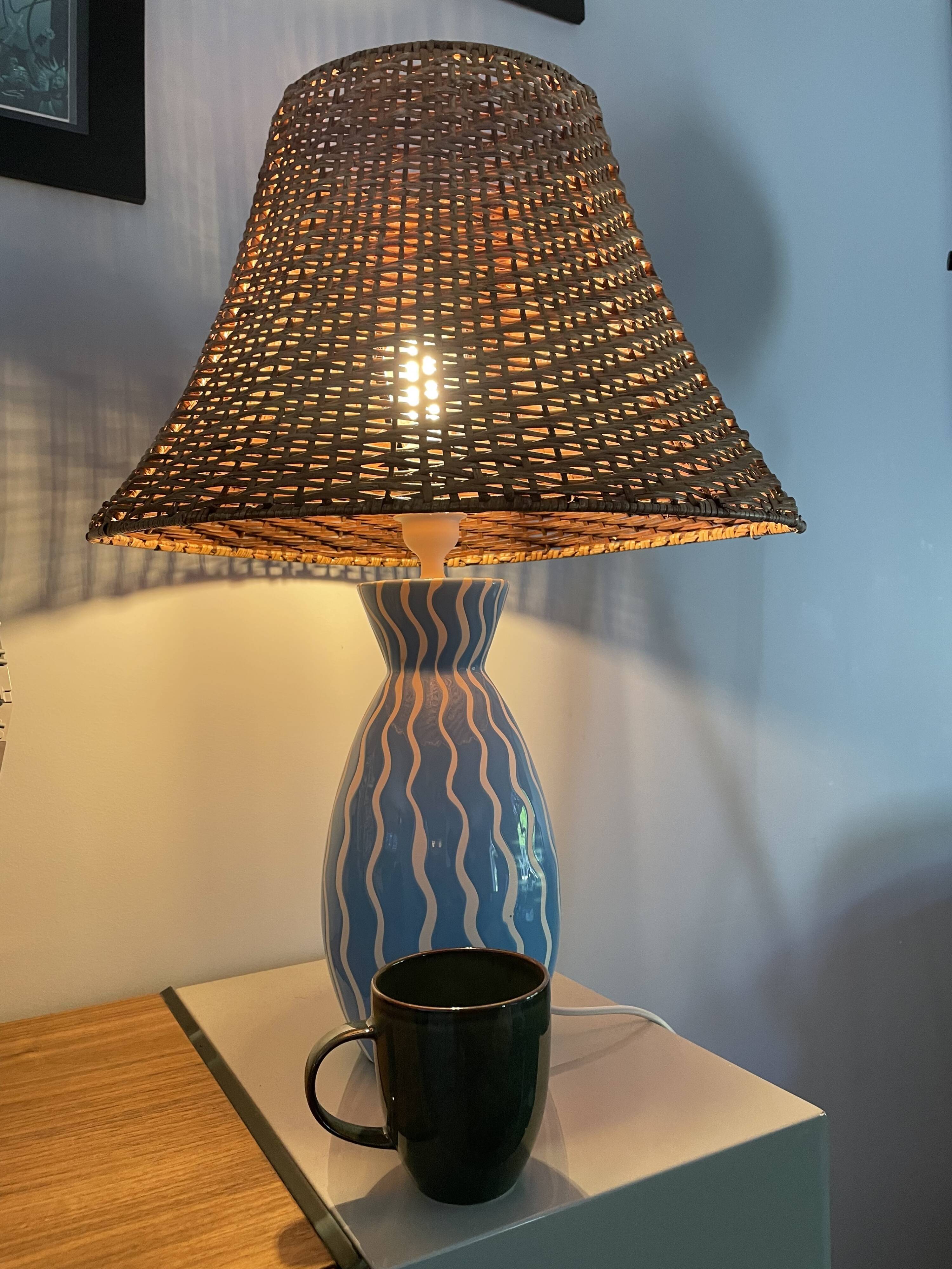 Blue ceramic lamp and rattan