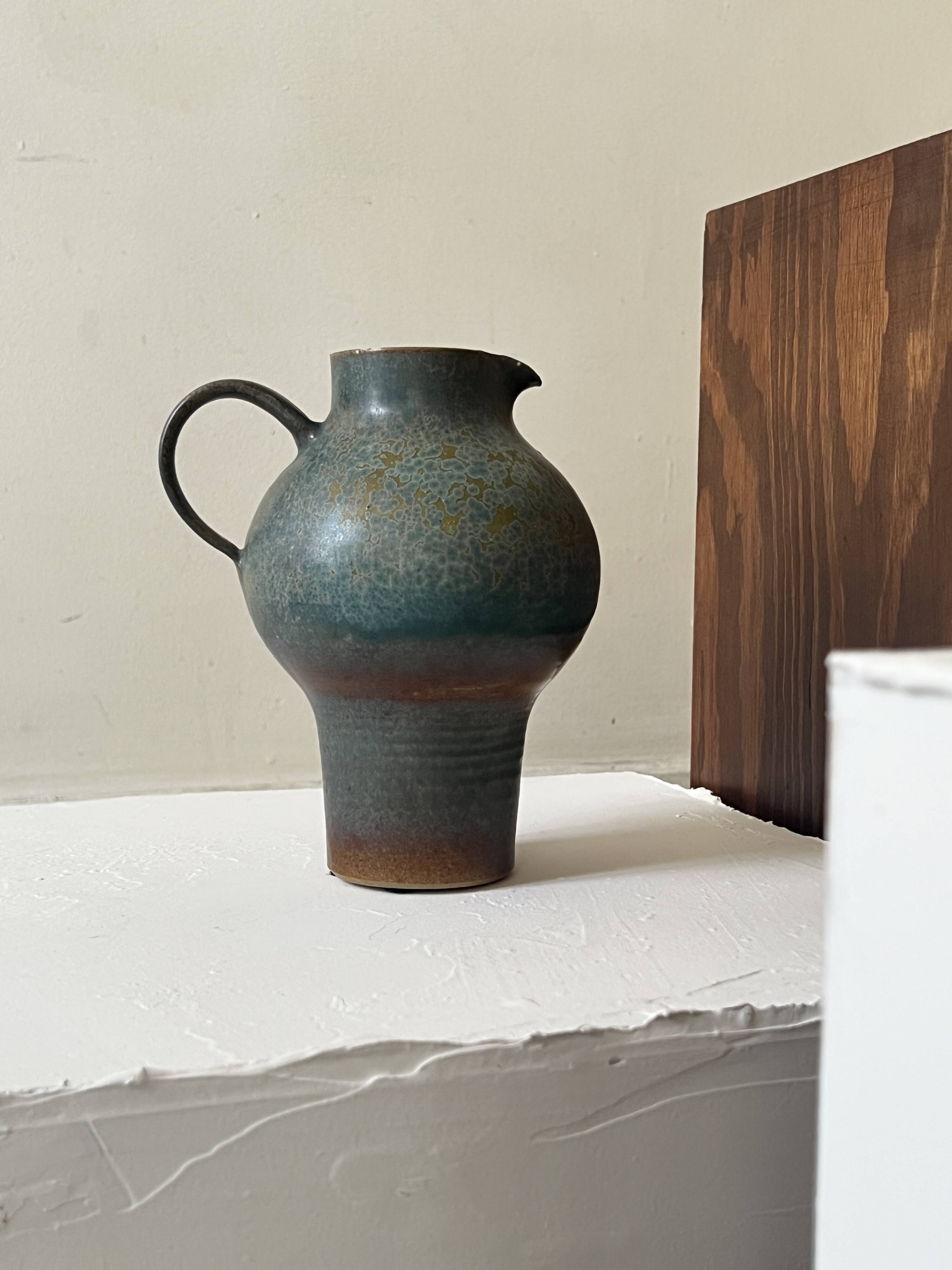 Brownish blue ceramic vase signed AH, France 1950.