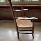 Fauteuil rustique en bois et paille