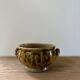 Vintage ceramic flowerpot with braided ears