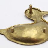 Empty brass duck pocket