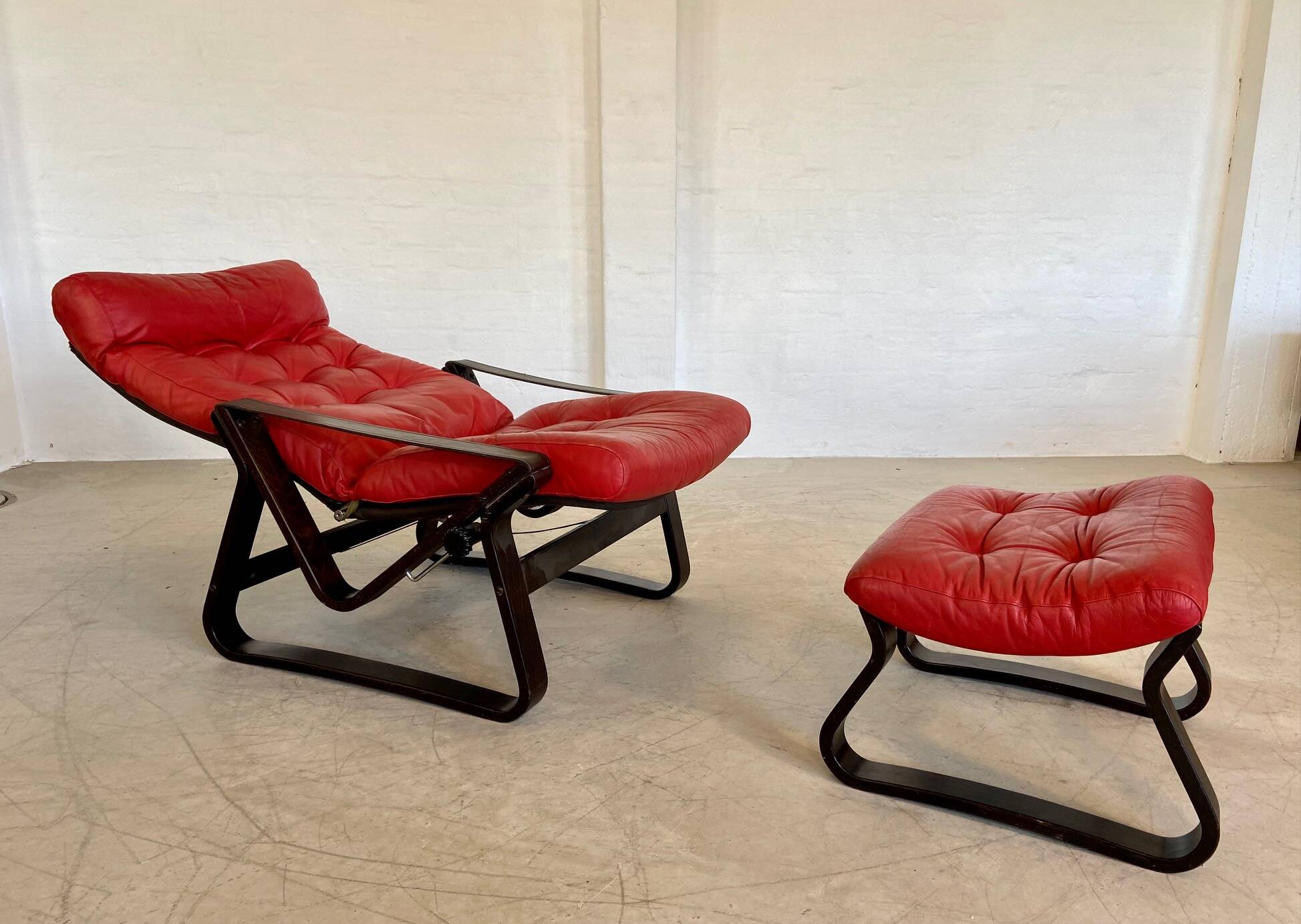 Vintage danish retro reclining lounge chair & stool in red leather by komfo