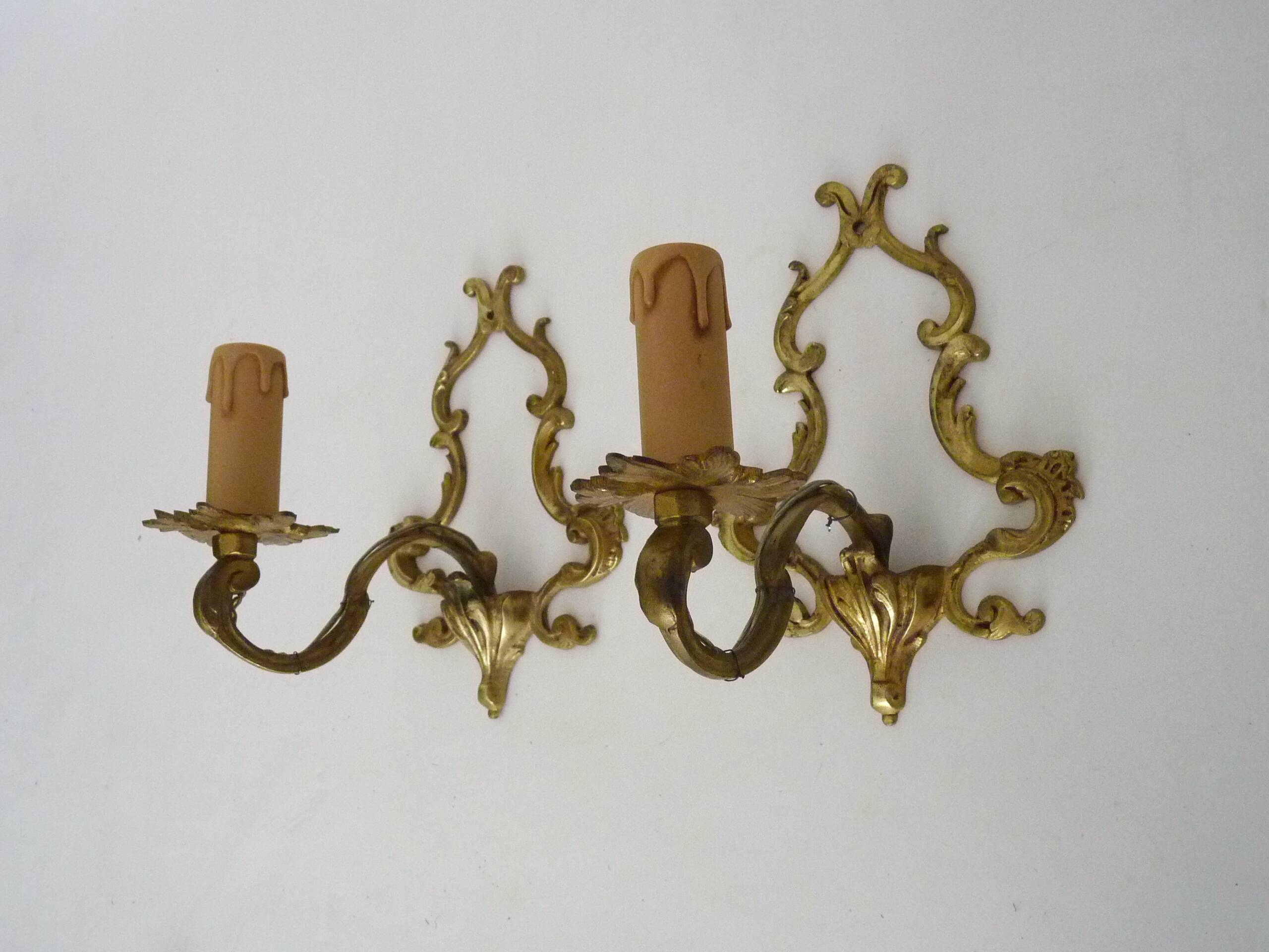 Vintage pair of bronze wall sconces from the 1950s and 60s.