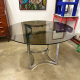 Dining table in chrome metal and smoked glass.