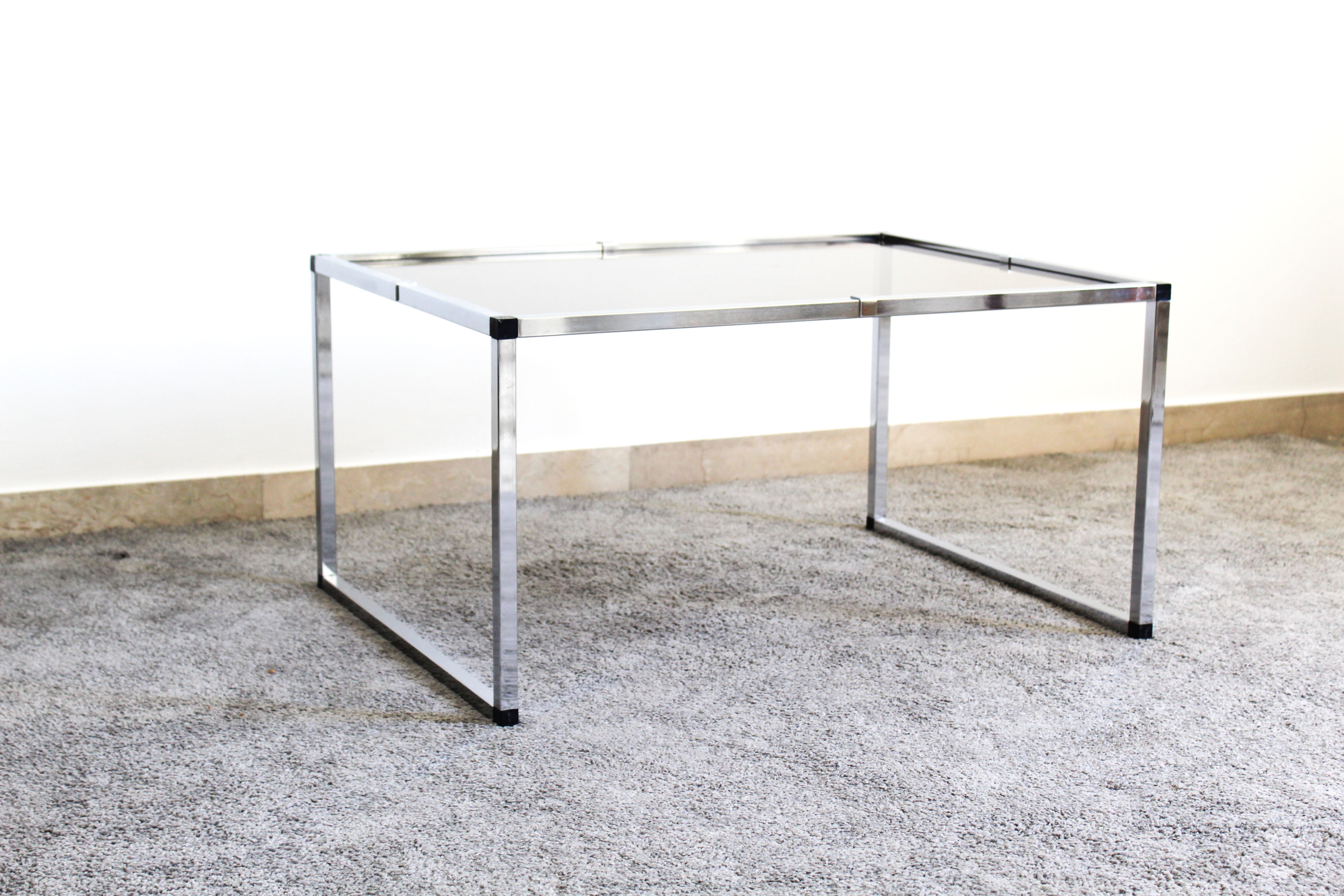 Pair of Coffee Tables in chromed metal and smoked glass, Italy 70's