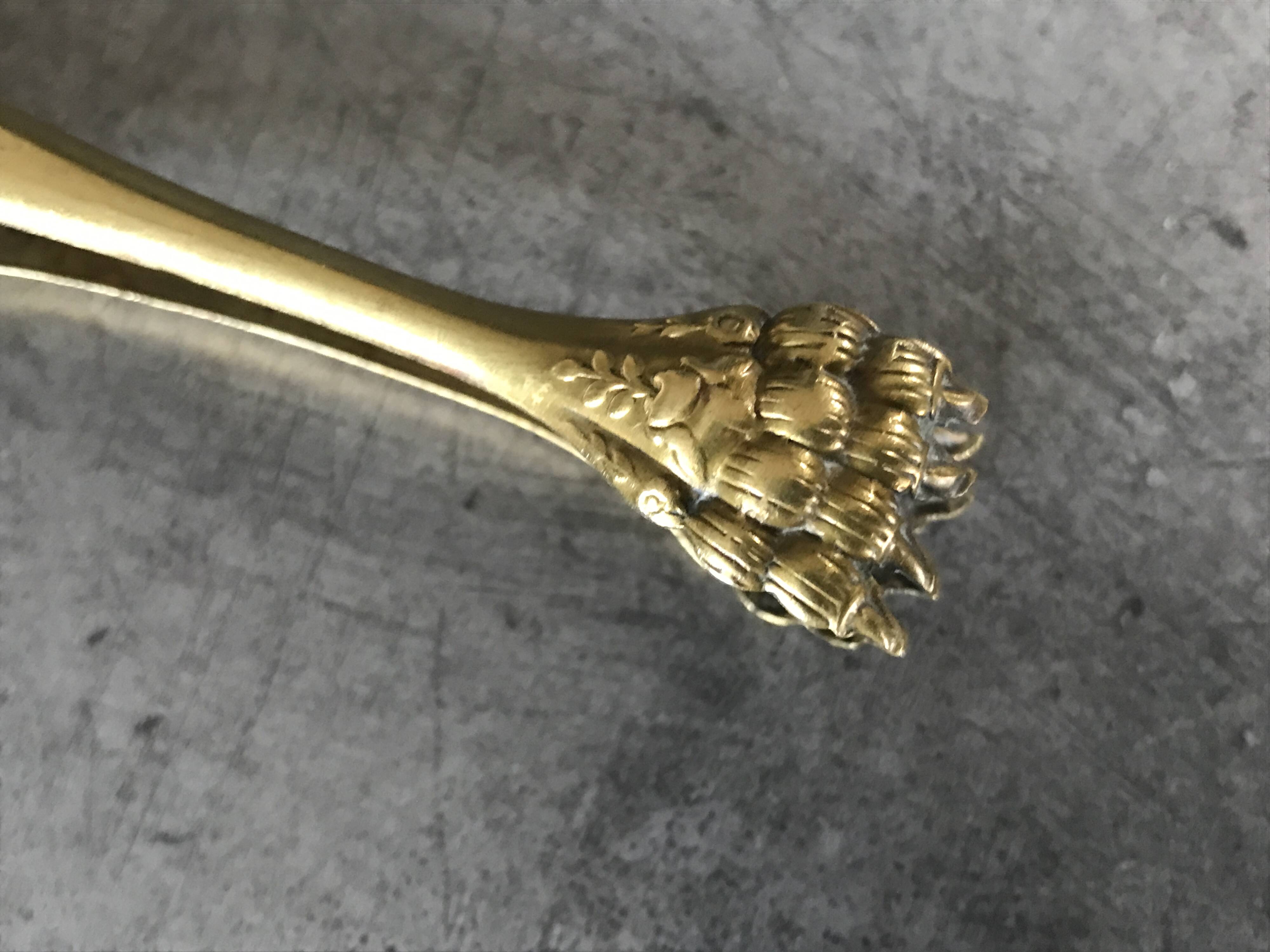 Sugar or ice cube tongs, gold star stamp with lion paw finish