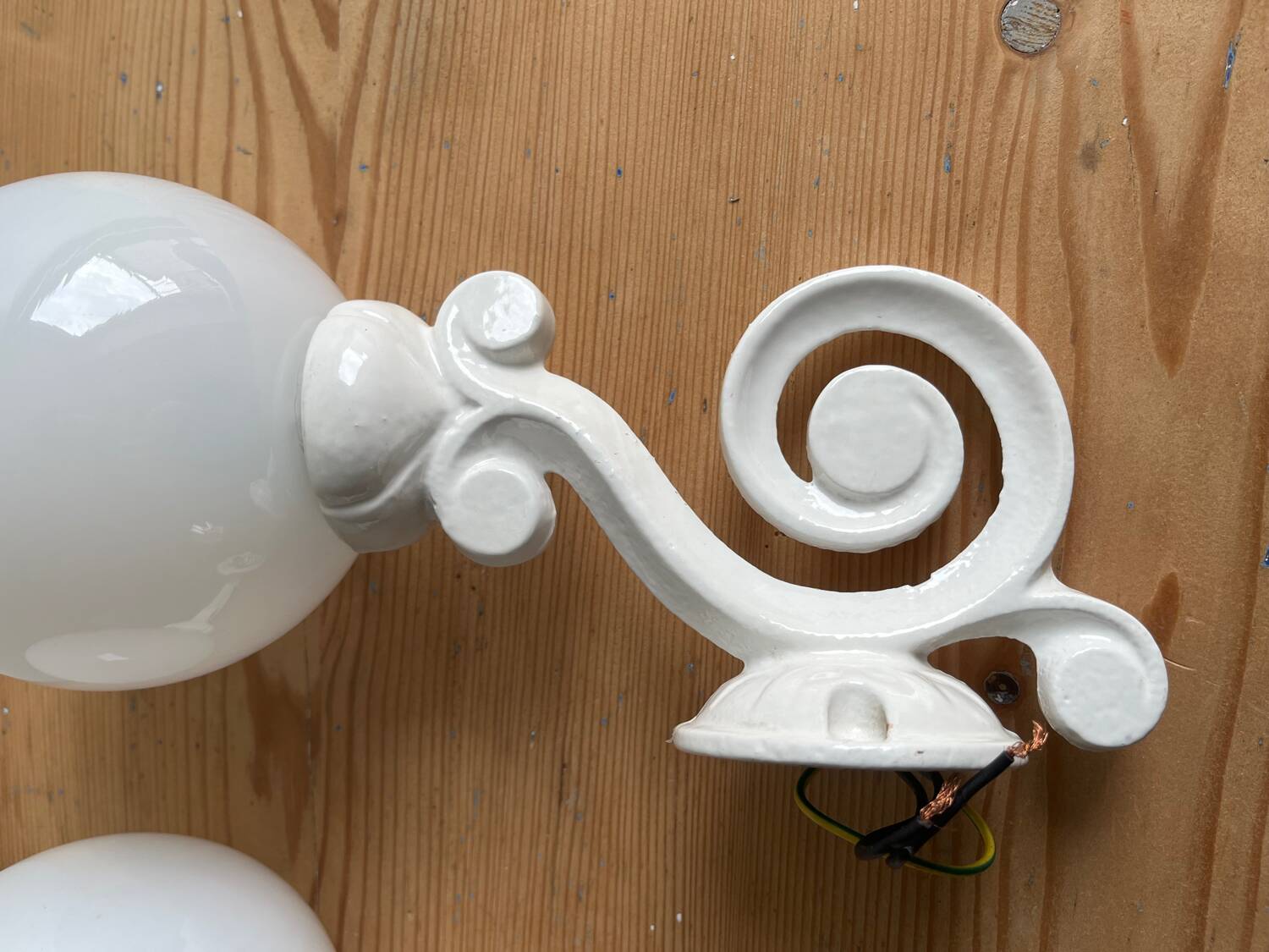 Antique enamelled cast iron wall lights / opaline globe