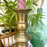 Pair of old candle holders in golden brass