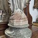 Garden statue of the Virgin Mary in old reconstituted stone