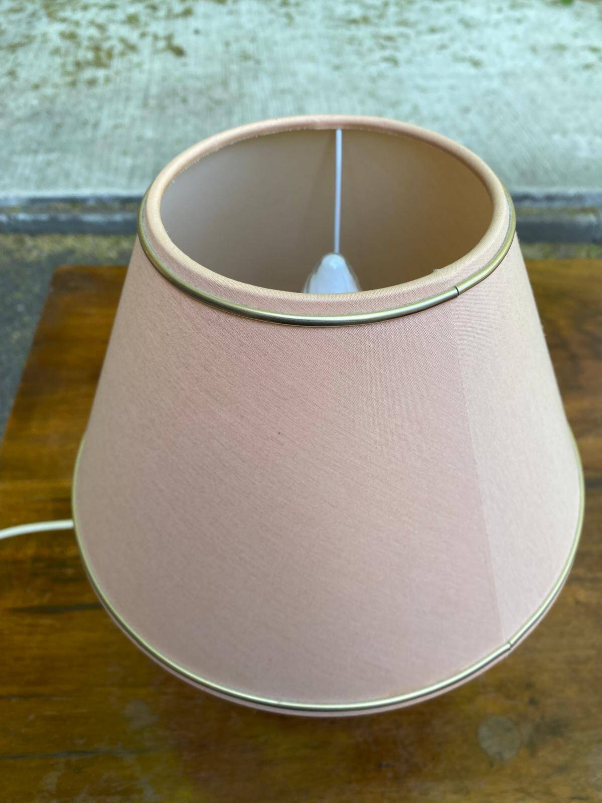 Vintage green ceramic bedside lamp with a pink-beige lampshade.