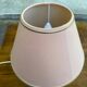 Vintage green ceramic bedside lamp with a pink-beige lampshade.