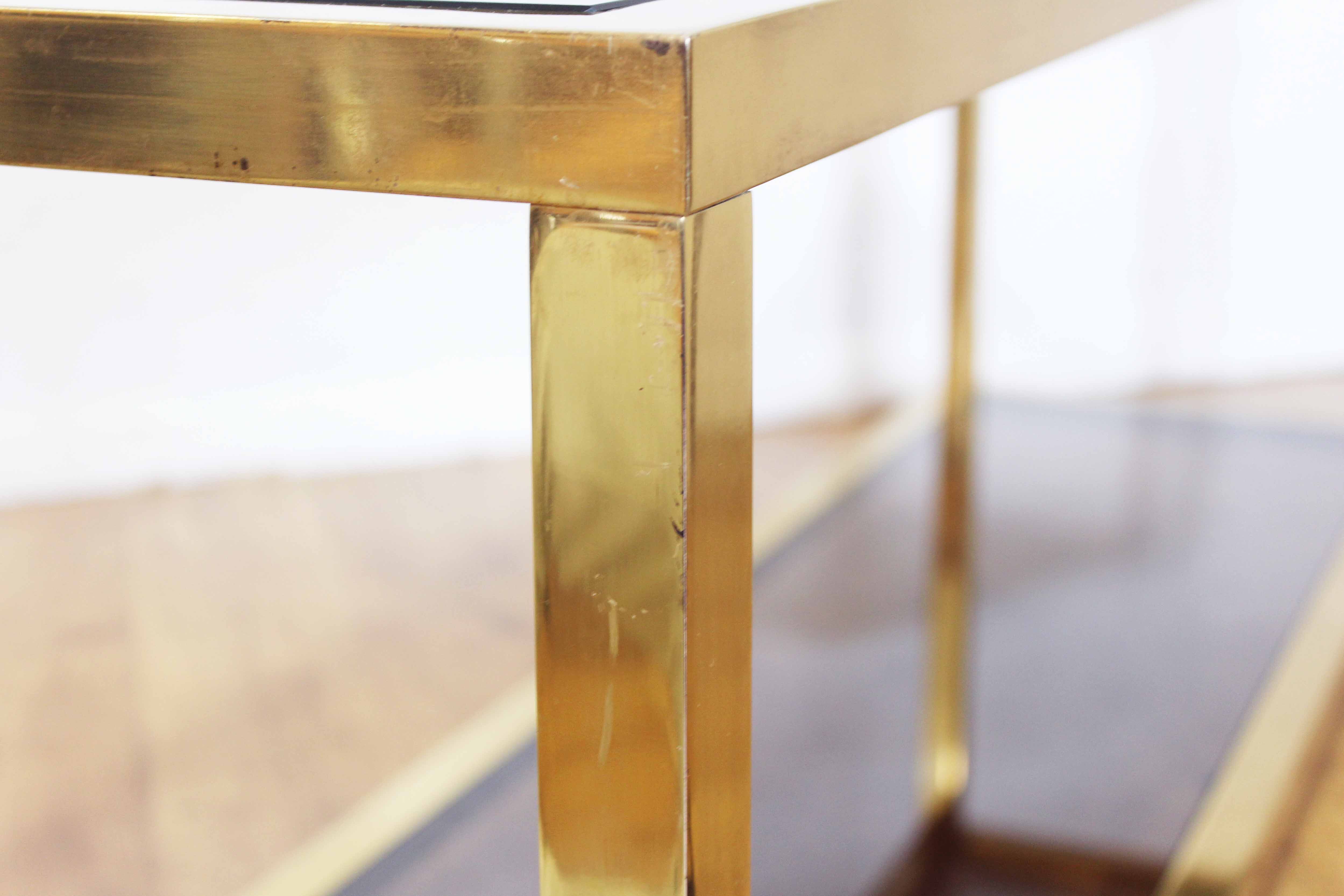 Brass console and smoked glass