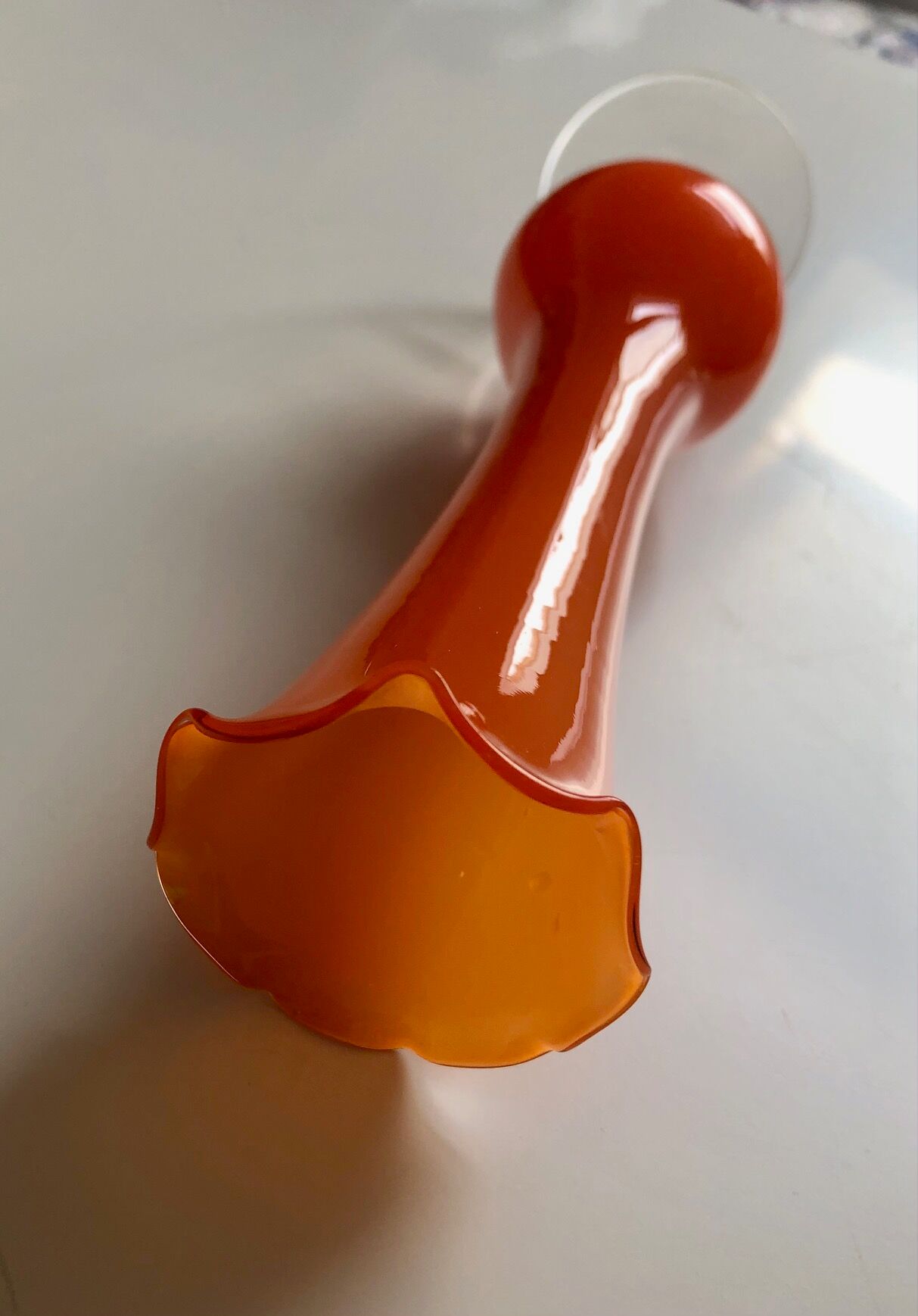 Soliflore in orange glass