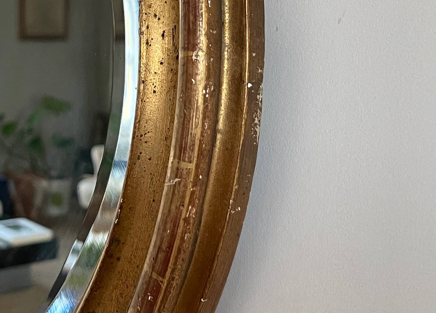 Antique oval gilt mirror.