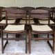 Set of 12 "sledge" dining chairs in walnut and cane.