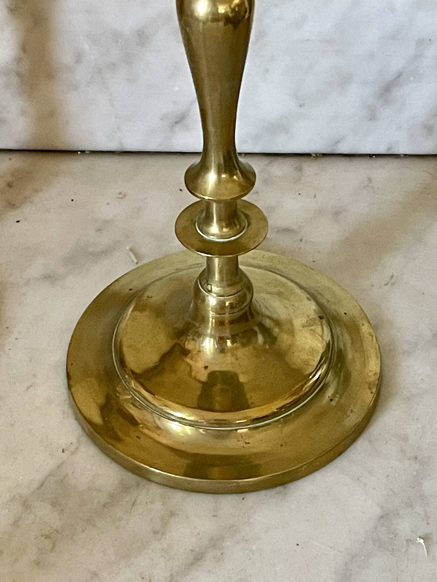 Old pair of turned brass candlesticks