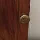 Key box in wood and brass and central motif representing a sailor's anchor