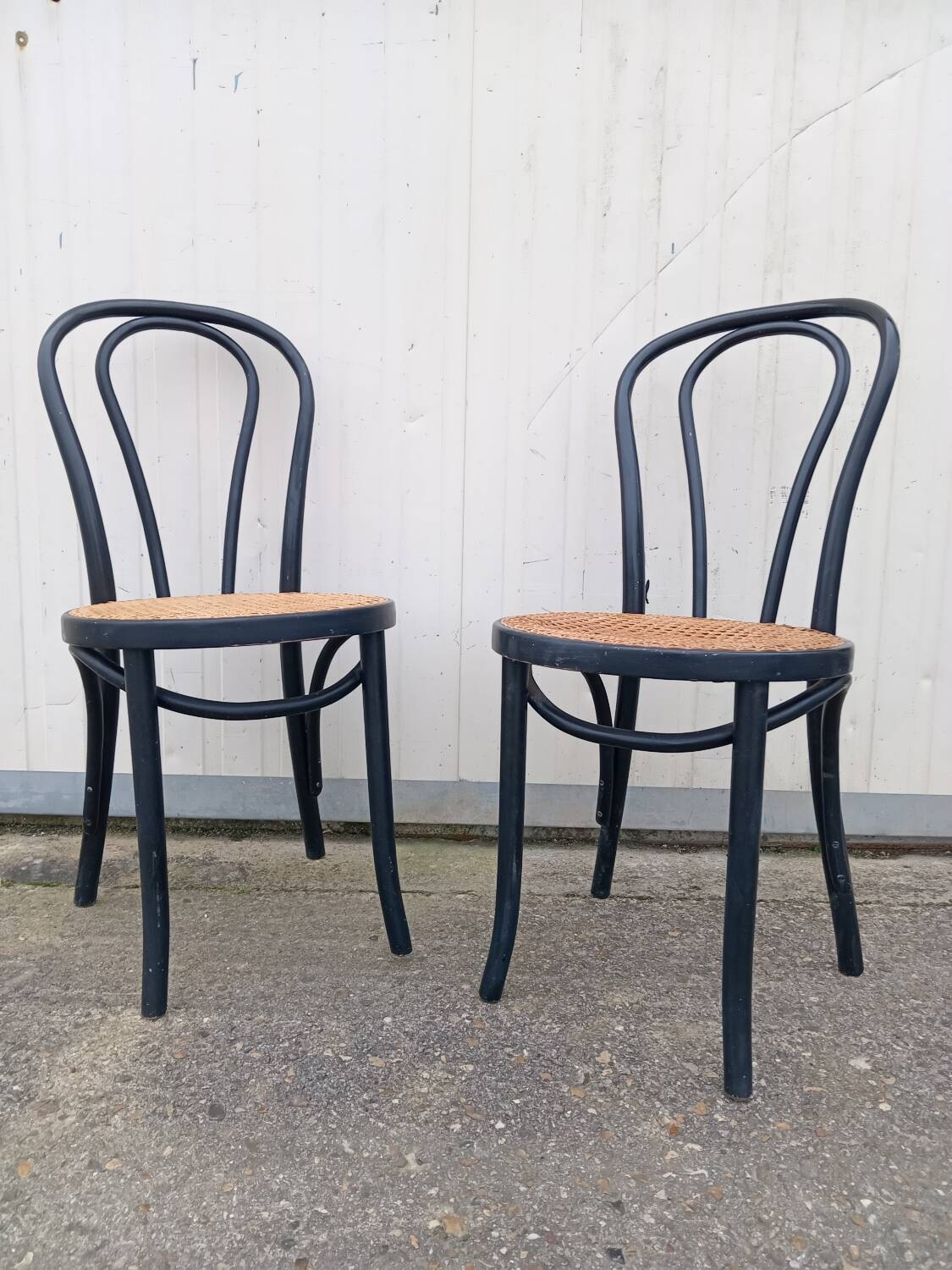 Pair of fmg bentwood and cane bistro chairs
