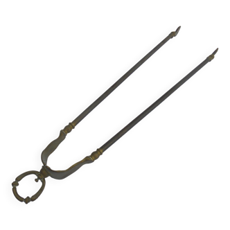 Brass fireplace log clip