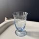 Set of 32 vintage glacier blue engraved stemmed glasses.