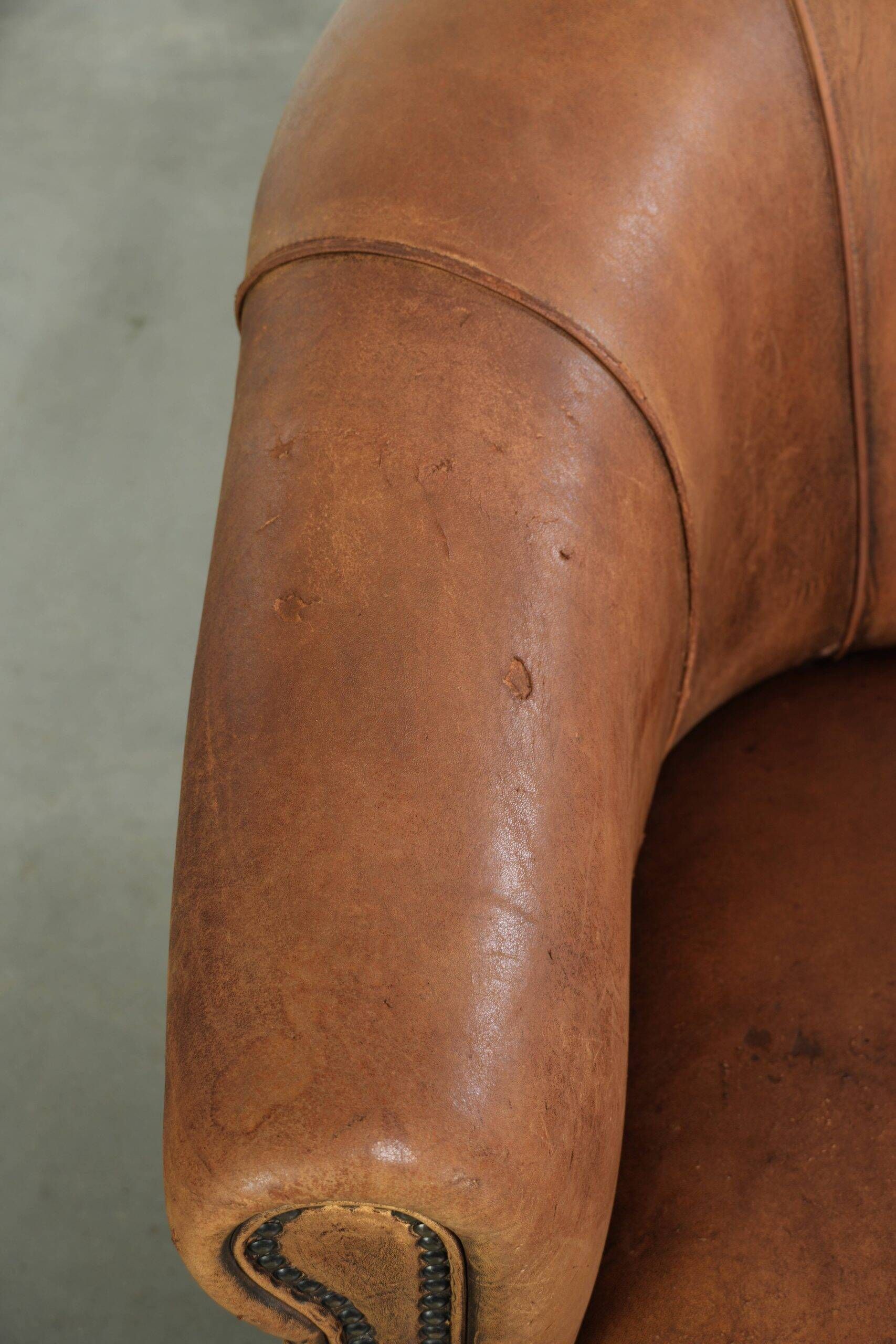 Vintage sheepskin clubchair in a beautiful cognac colour with a sturdy look