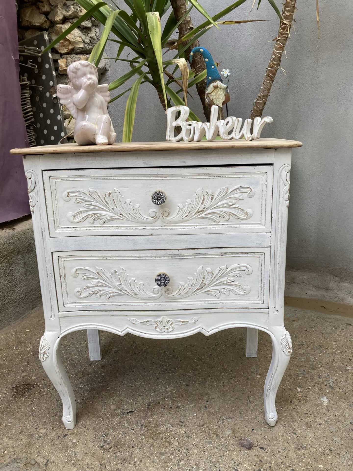 Adorable small chest of drawers or weathered white console.