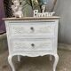 Adorable small chest of drawers or weathered white console.