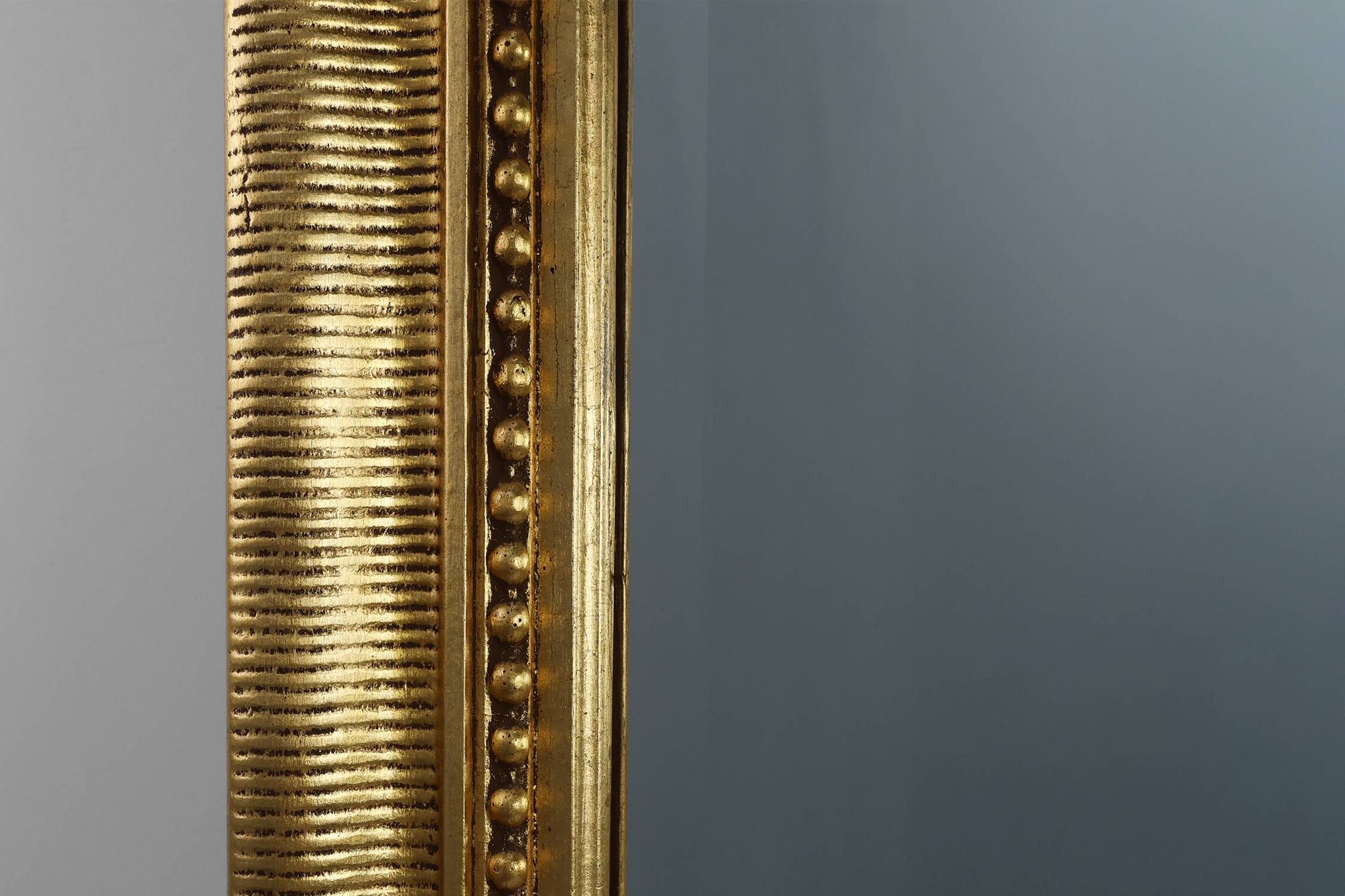Baroque mantel mirror in carved wood and gilded plaster, France circa 1850.