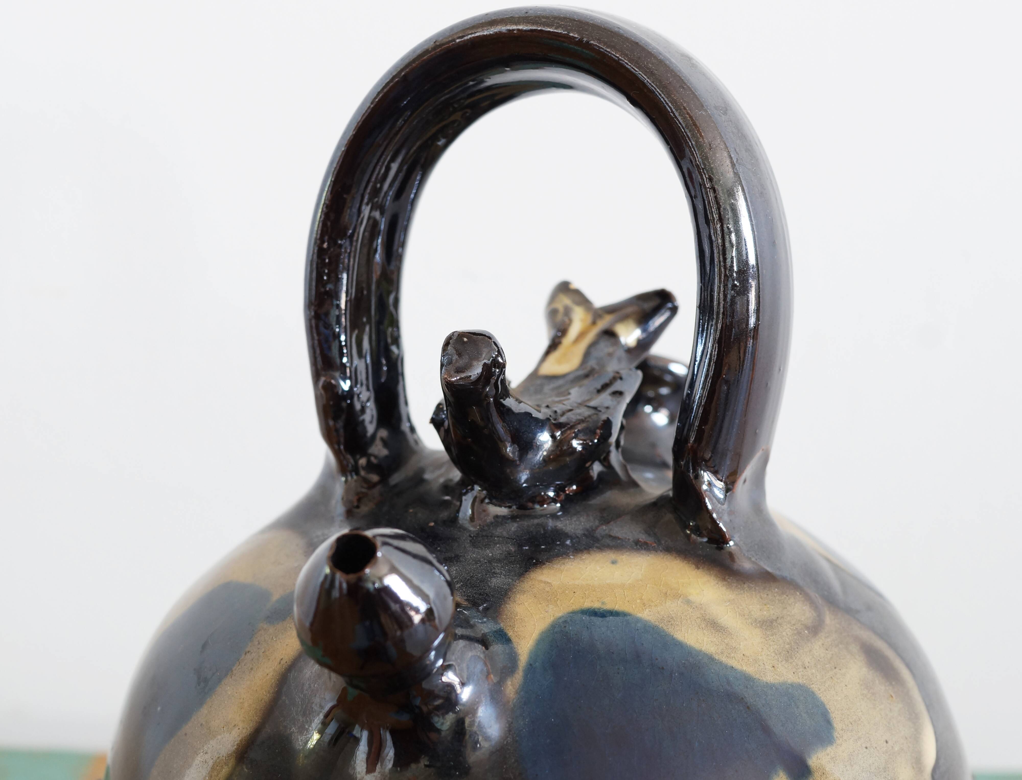 Glazed terracotta gargoulette with bird decoration