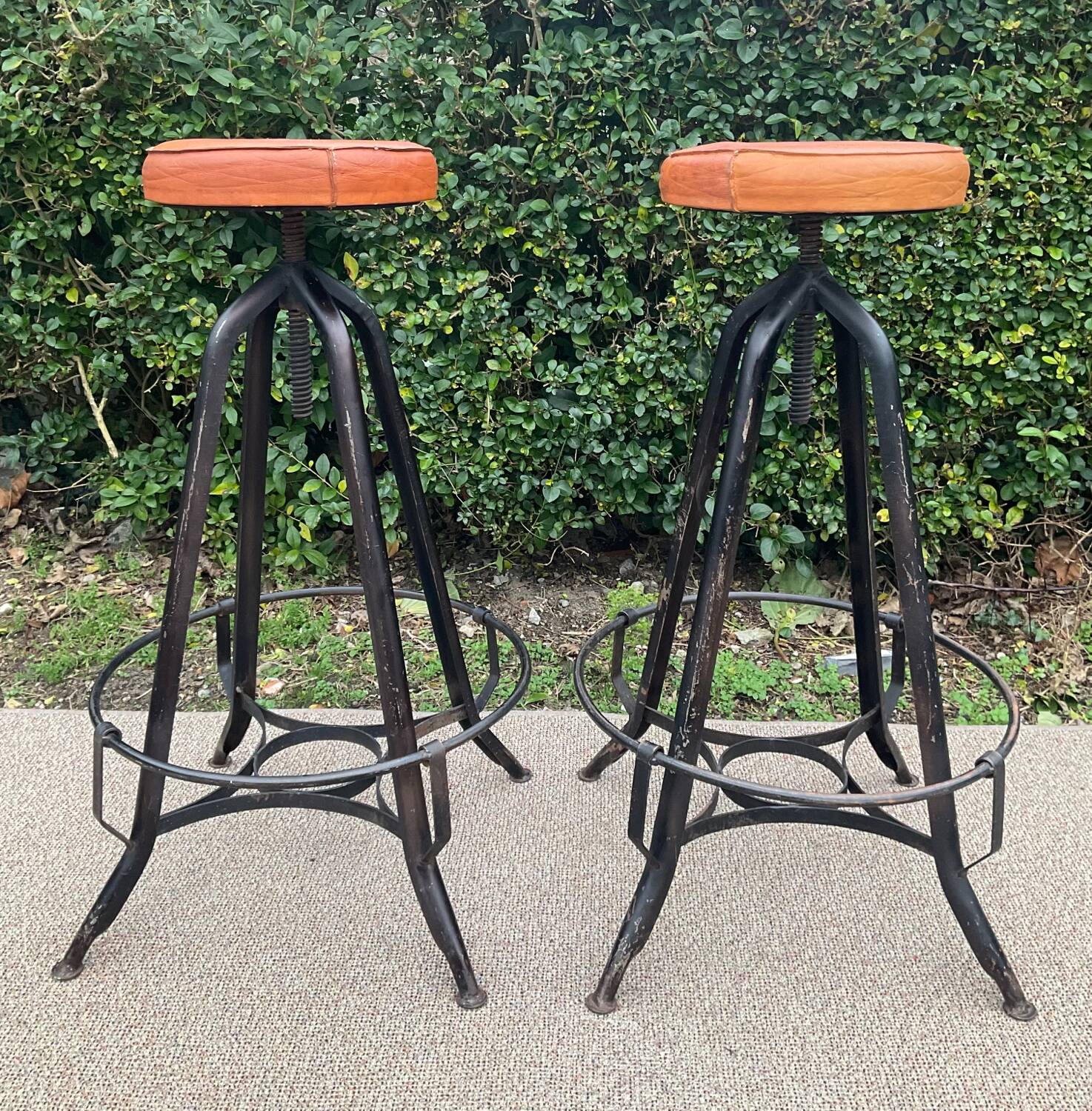 Pair of vintage metal and leather bar stools