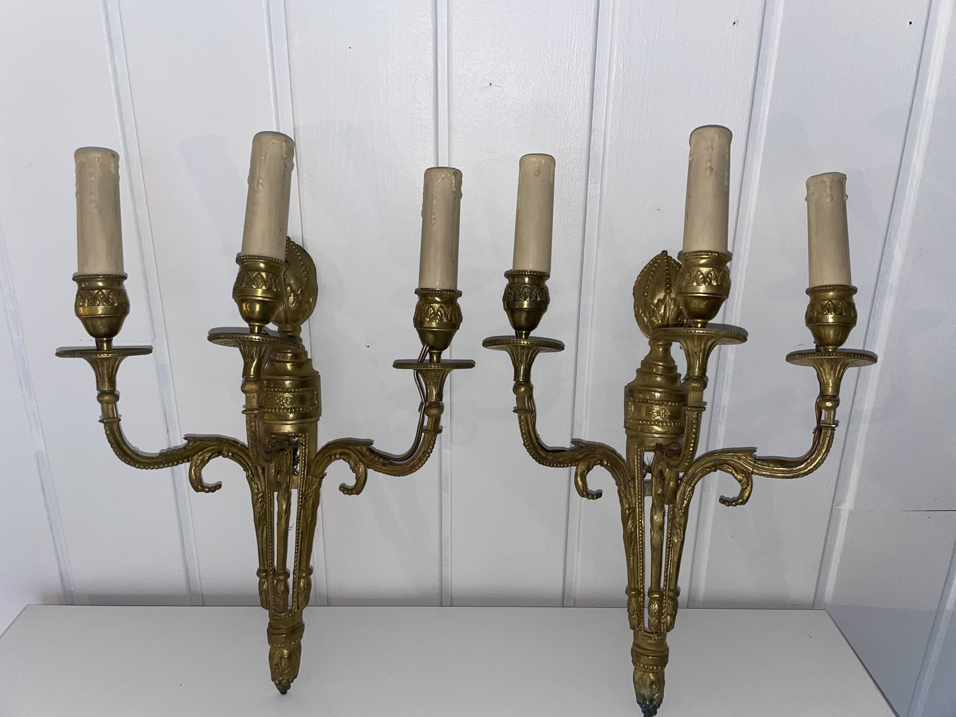 Pairs of Louis XVI bronze wall lamps