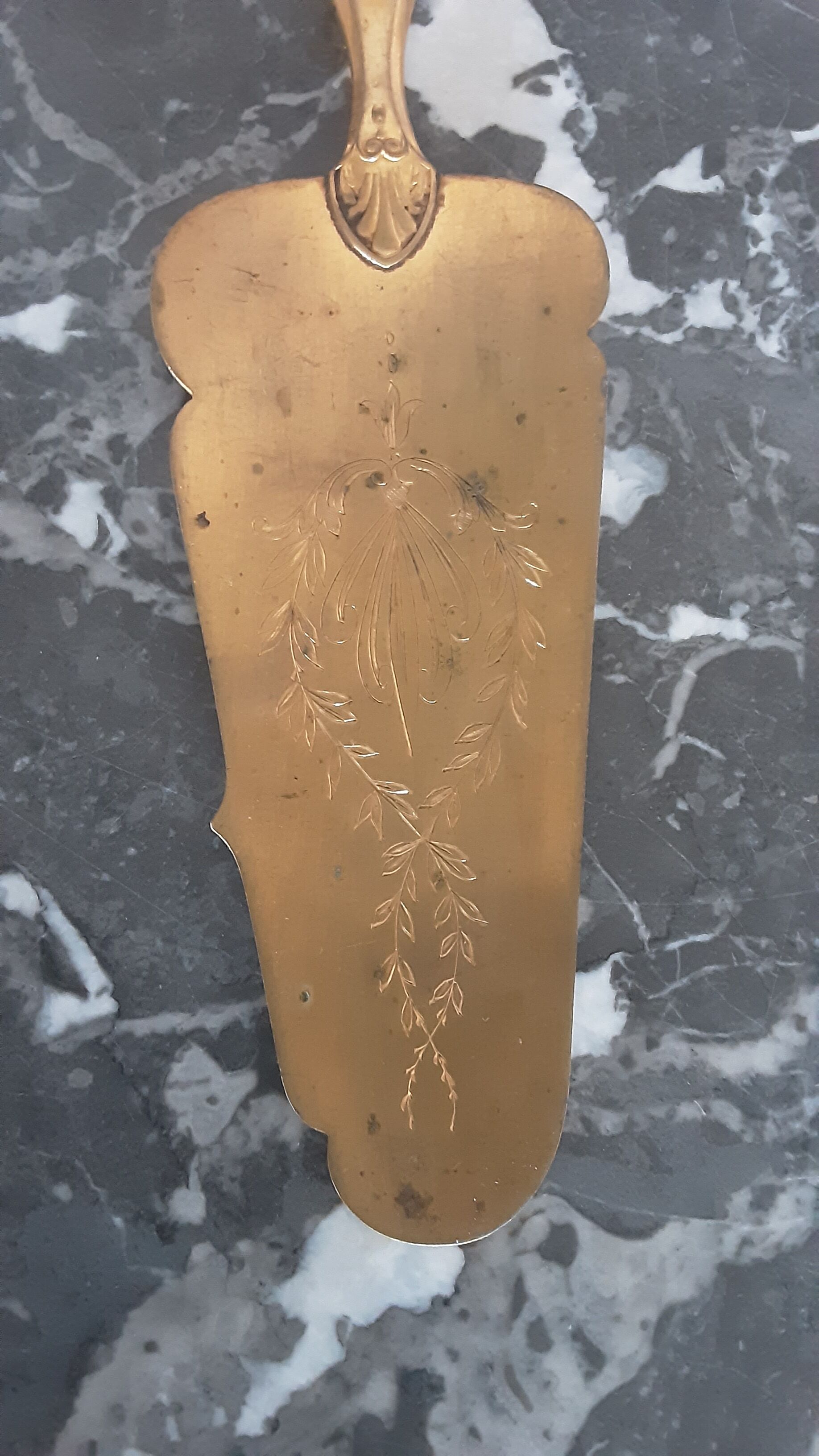 Old brass and silver pie shovel