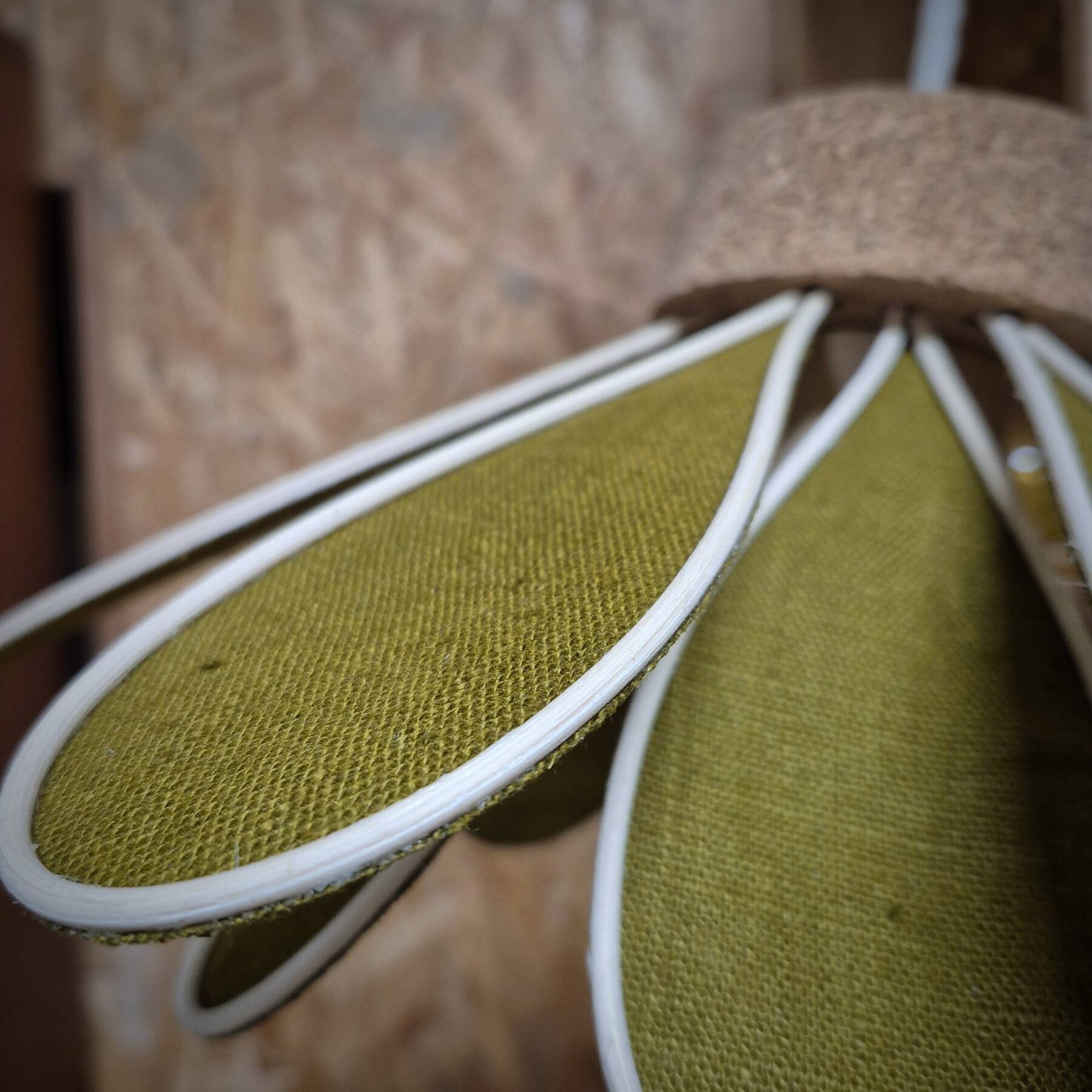 Iris flower pendant, 16 petals in olive green rattan and linen.