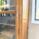 Glass-fronted walnut library 1900