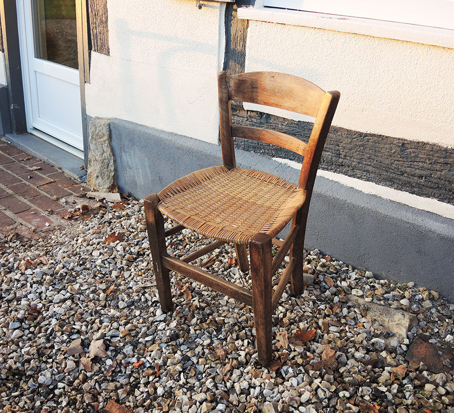 Old woven straw children's chair