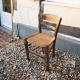 Old woven straw children's chair