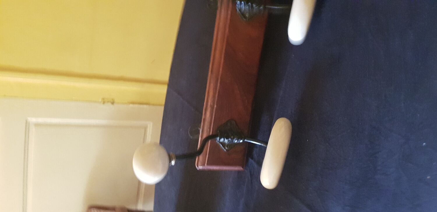 Ceramic and walnut coat rack. The 50's.