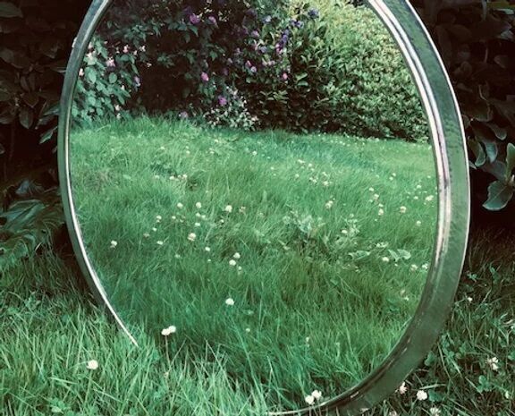 Hammered metal round mirror