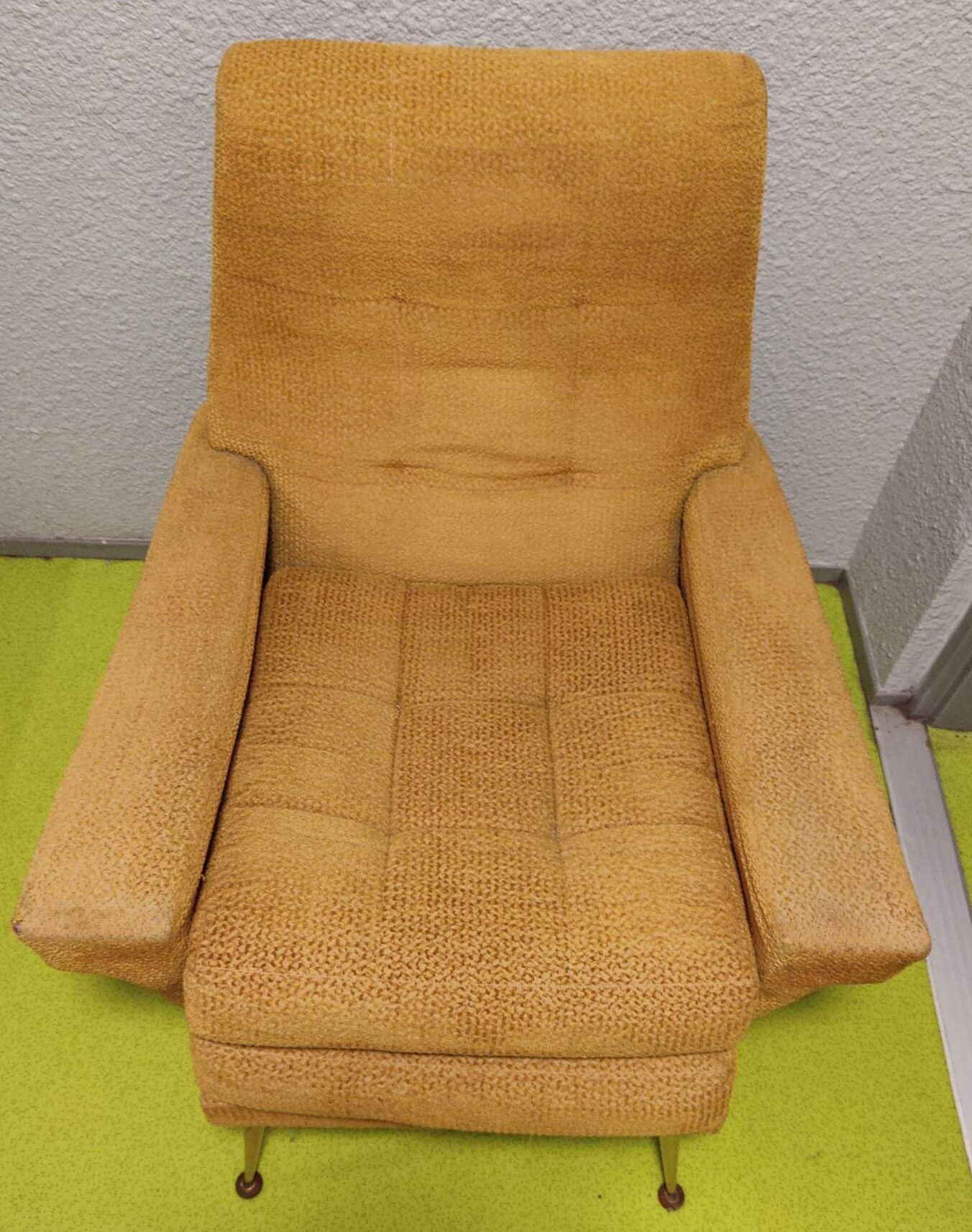 Old velvet heating chair on metal legs